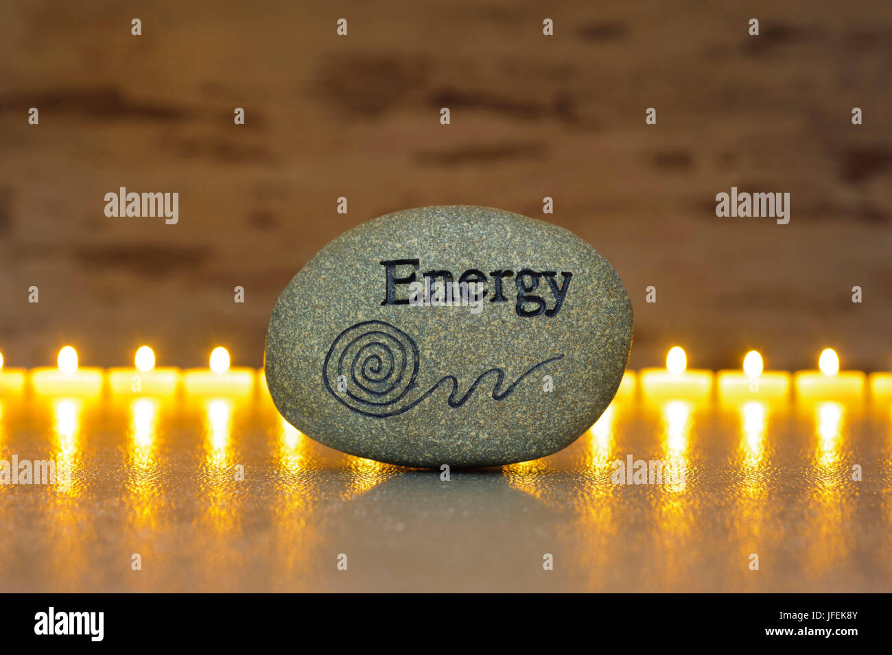ZEN, détente, stone, Energy, Staffel of candles in the background Stock Photo