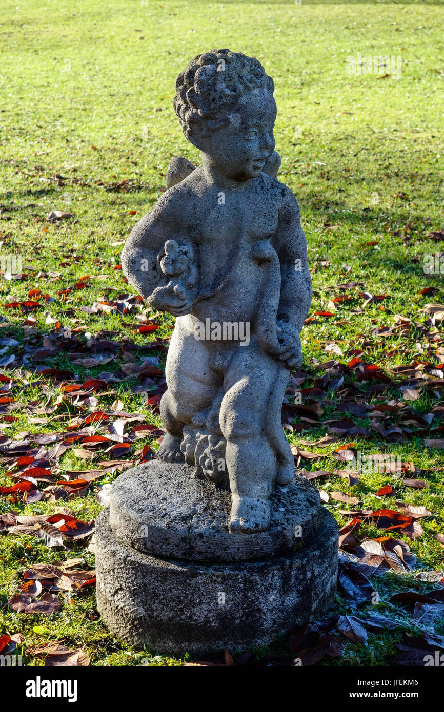 Weather-beaten stone sculpture in the castle grounds Hohenried, Lake Starnberg, Bavaria, Germany Stock Photo