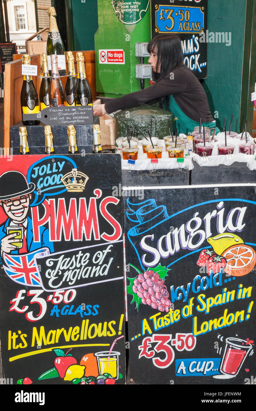 England, London, Southwark, Borough Market, Wine Shop Pimm's and Sangria Advertising Boards Stock Photo