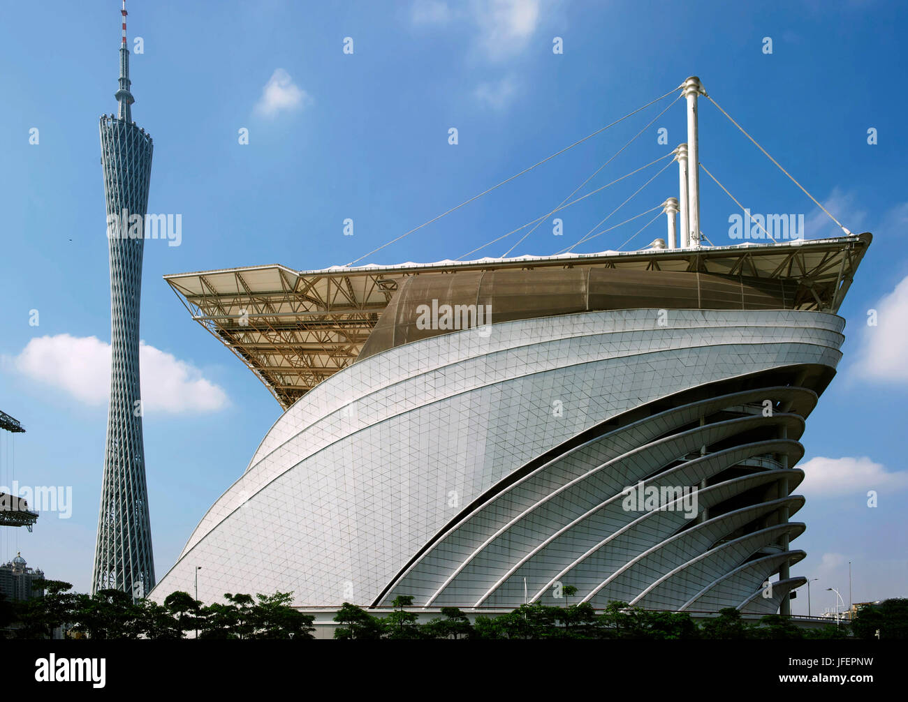 China, Guangdong province, Guangzhou, Zhujiang New Town area, Opera House by architect Zaha Hadid and stadium Stock Photo