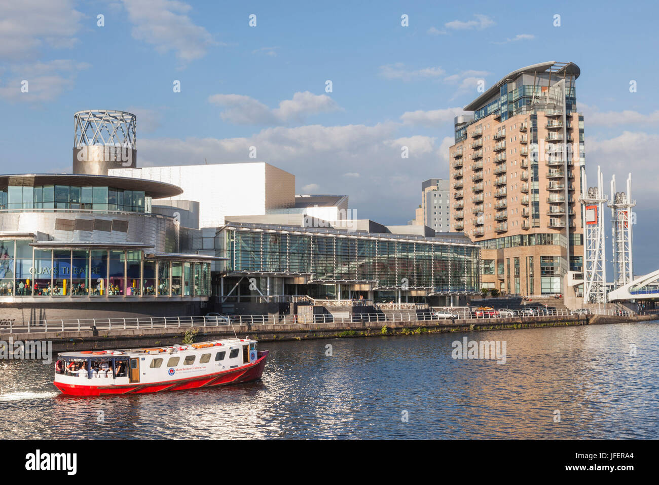 England, Manchester, Salford, The Quays, The Lowry and Tour Boat Stock Photo