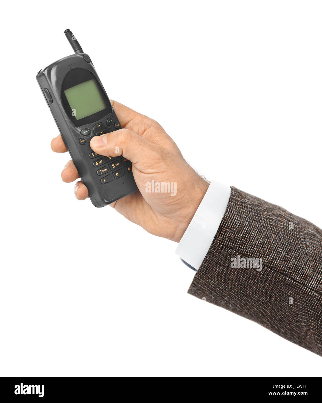 Hand with retro mobile phone Stock Photo