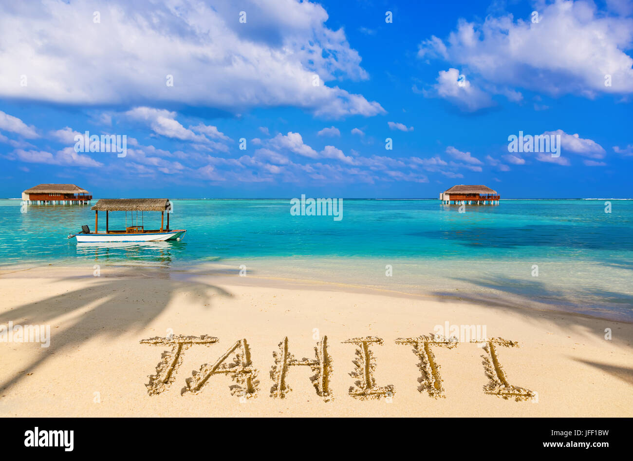Word Tahiti on beach Stock Photo