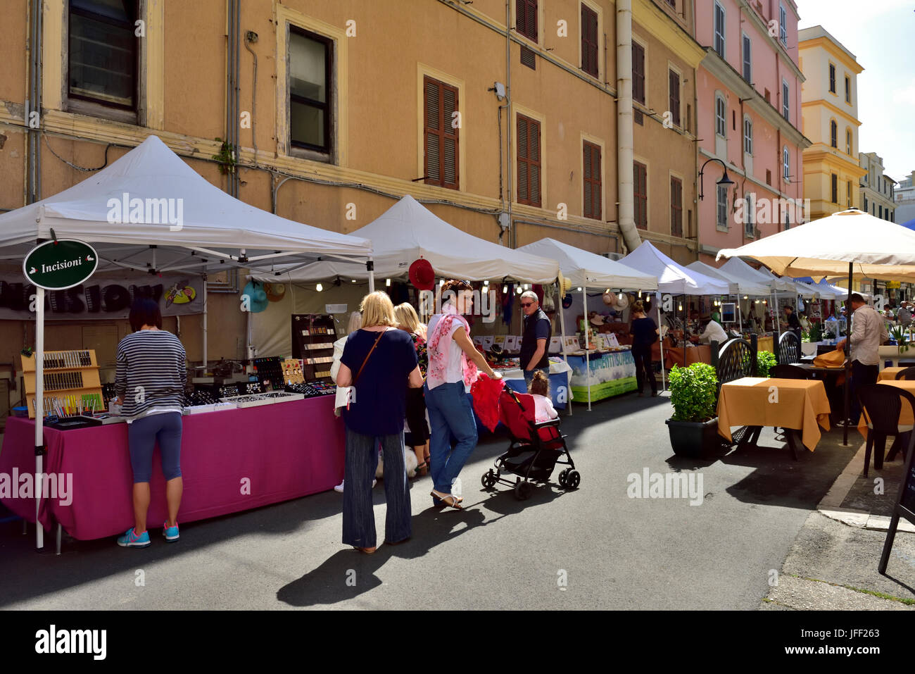 Market stalls set up along street in the centre of Anzio, Italy Stock Photo