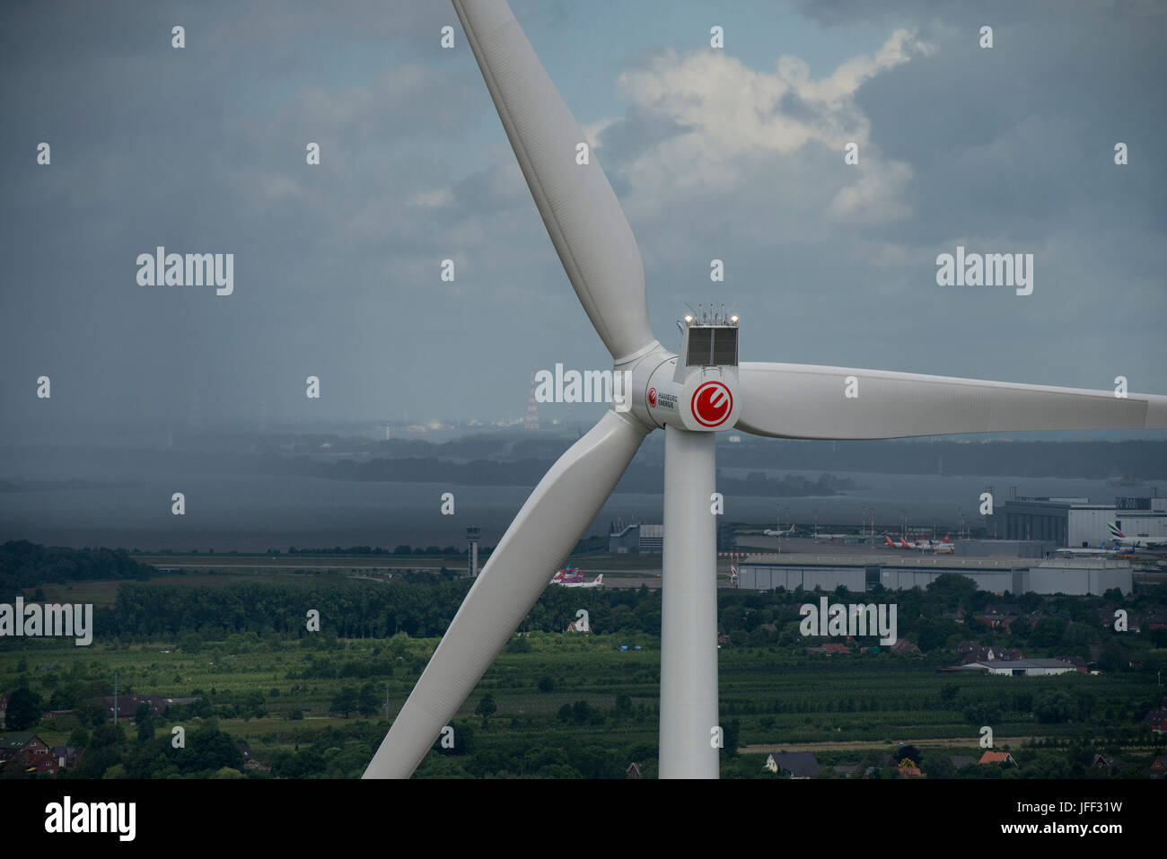 GERMANY Hamburg, wind turbine Siemens SWT-3.0-113 of Municipal energy supplier Hamburg Energie at Trimet area, behind airbus and river Elbe / DEUTSCHLAND, Hamburg, Trimet Gelaende, Siemens Windkraftanlage SWT-3.0-113 des kommunalen Stromerzeuger Hamburg Energie, Hintergrund Airbus Gelaende und Elbe Stock Photo