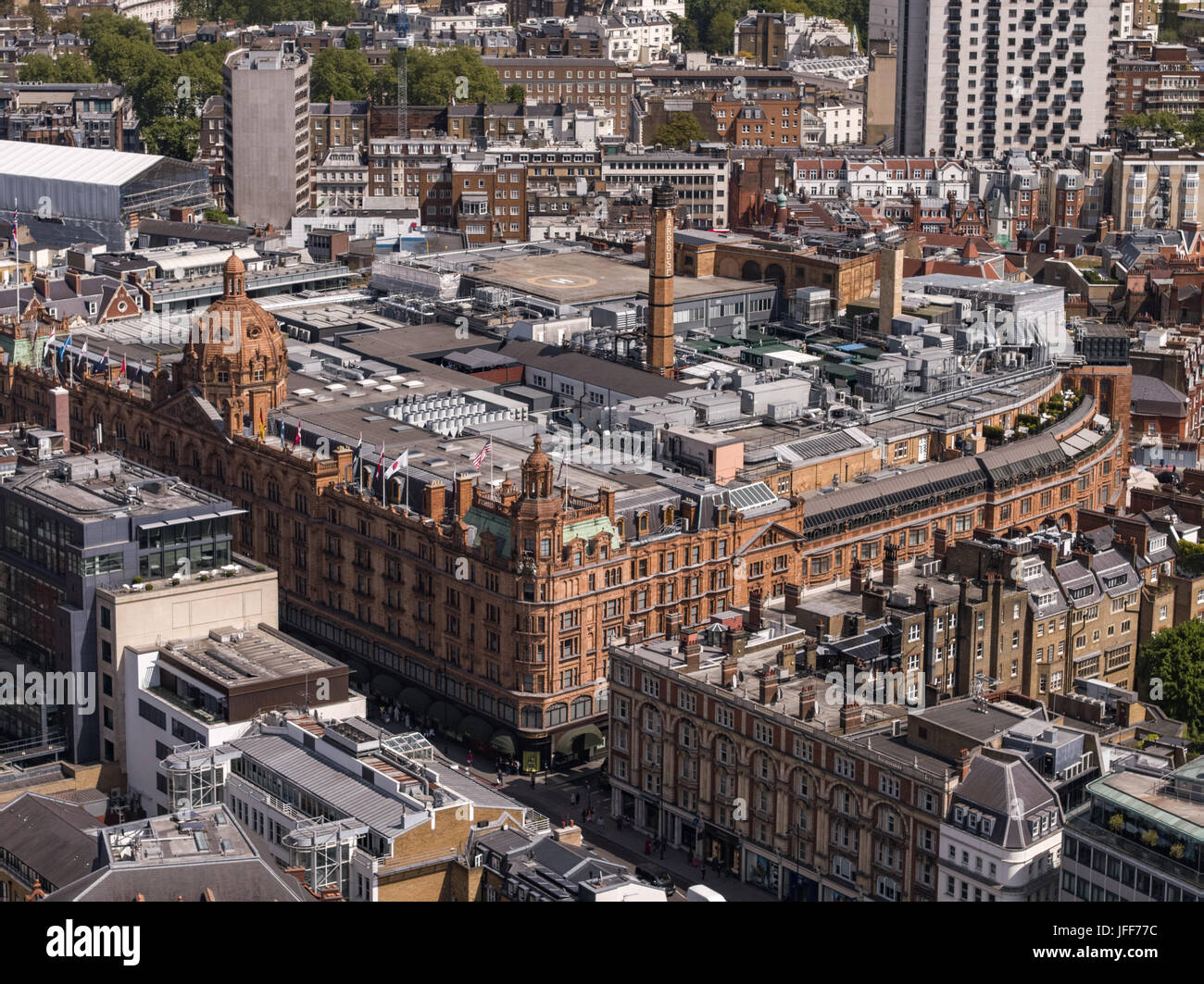 Aerial view over London England including Harrods Store. Harrods is a luxury department store located on Brompton Road in Knightsbridge, London. It is Stock Photo