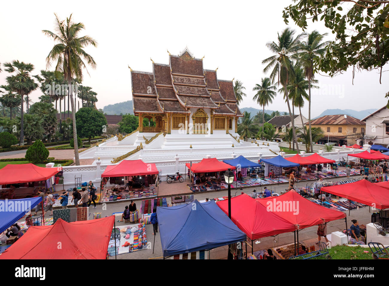 Street market next to Haw Pha Bang temple at the Royal Palace grounds in Luang Prabang, Laos, Asia Stock Photo