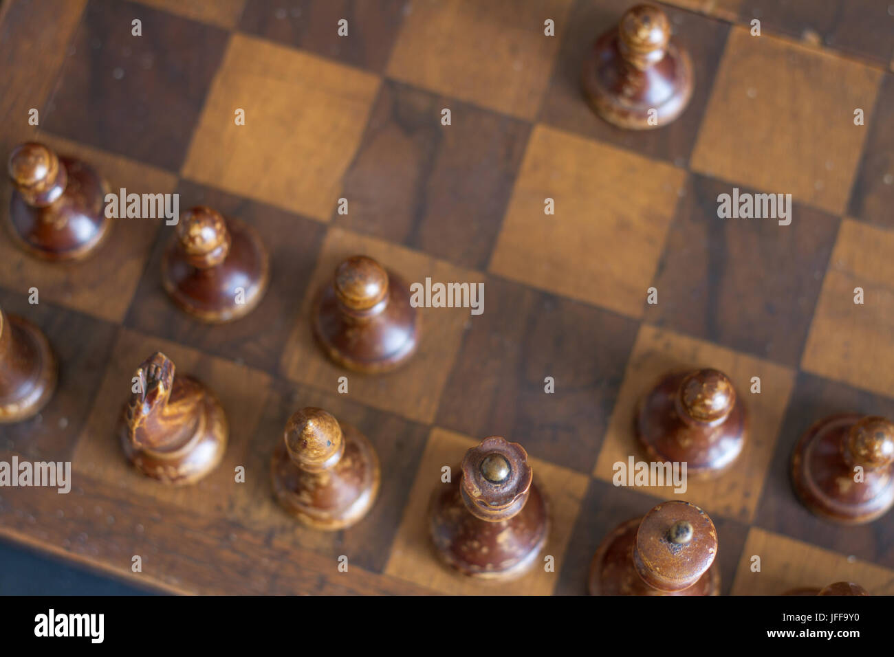 Ancient wooden chess pieces on an old chessboard Stock Photo - Alamy