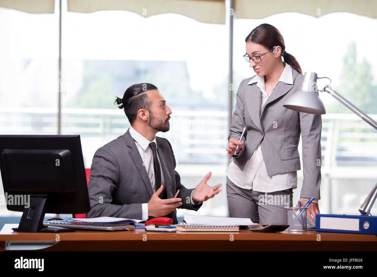 Happy man angry woman at office hi-res stock photography and images - Alamy