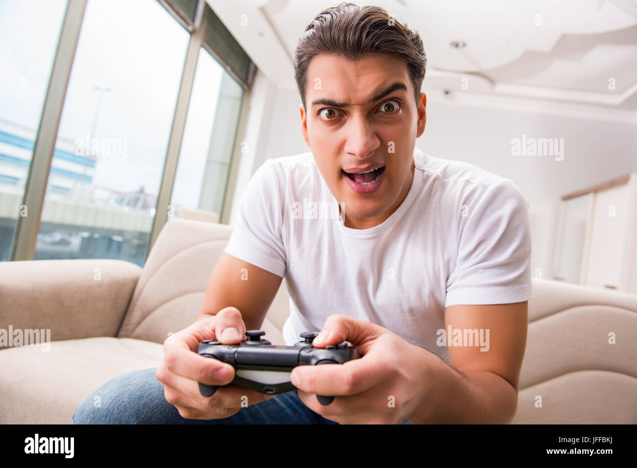 Man addicted to computer games Stock Photo Alamy