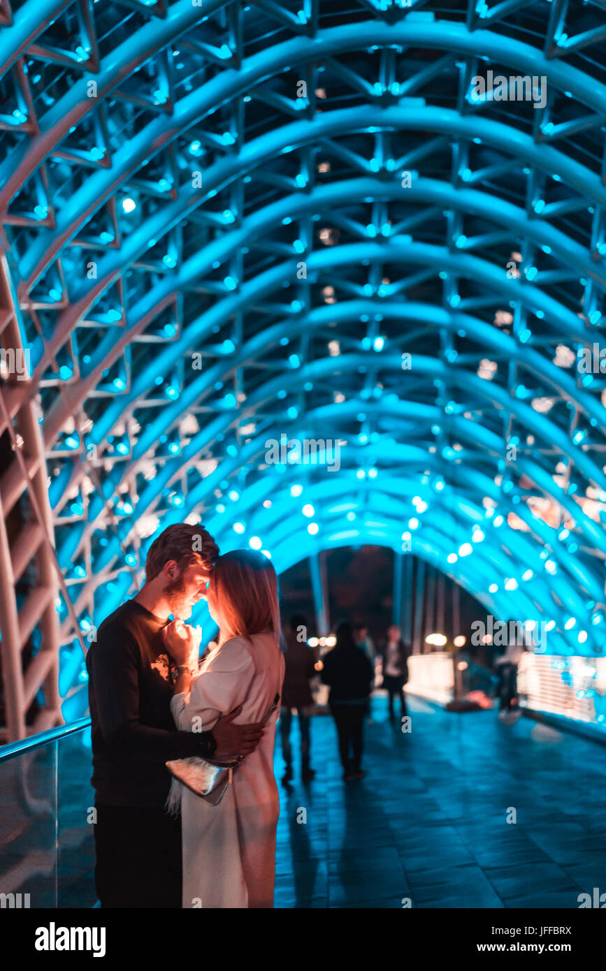 Loving couple on the bridge of Peace Stock Photo - Alamy