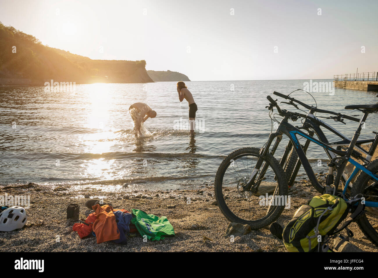 Men bathing in sea water Stock Photo Alamy