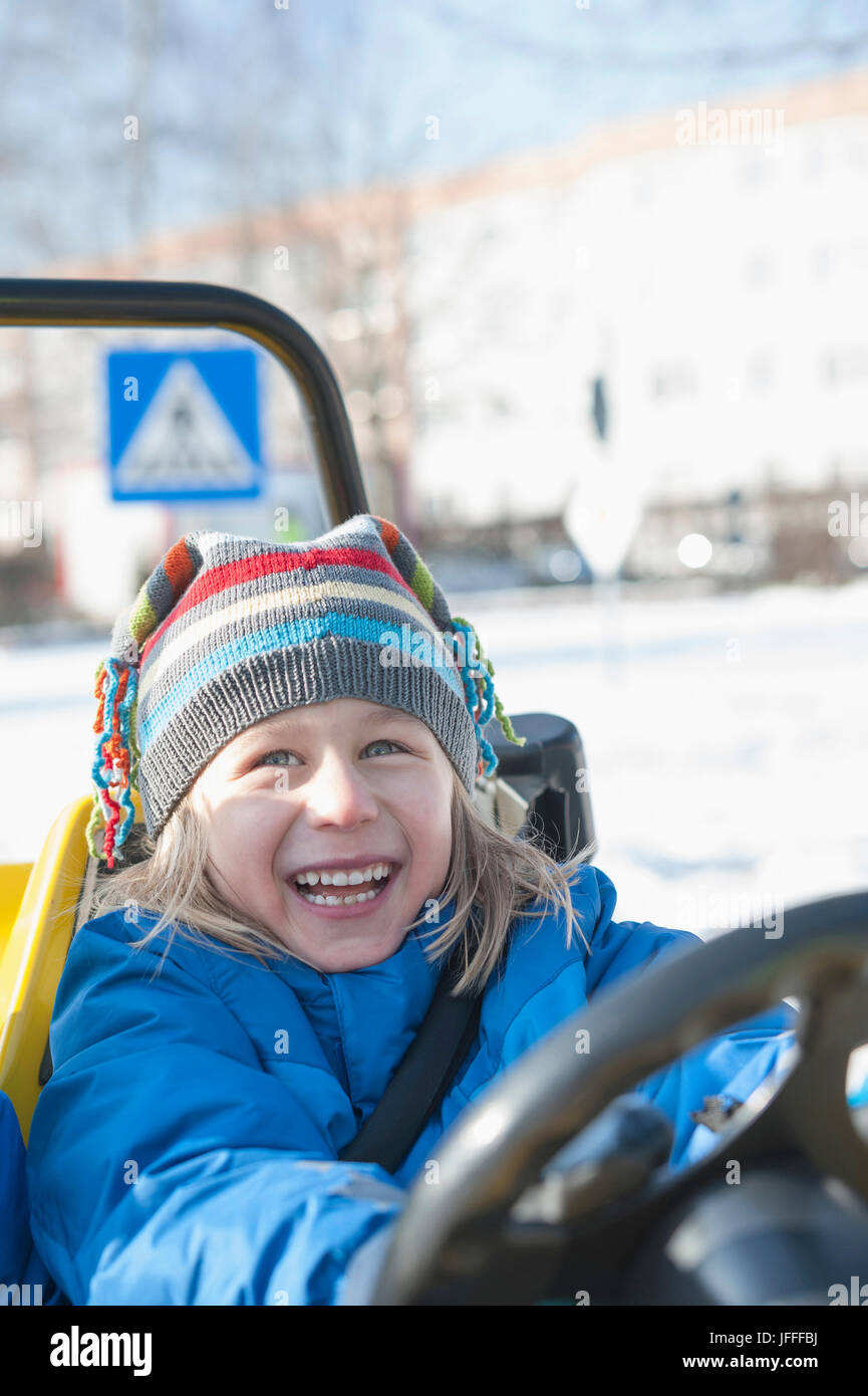 Boy driving electric toy car Stock Photo Alamy