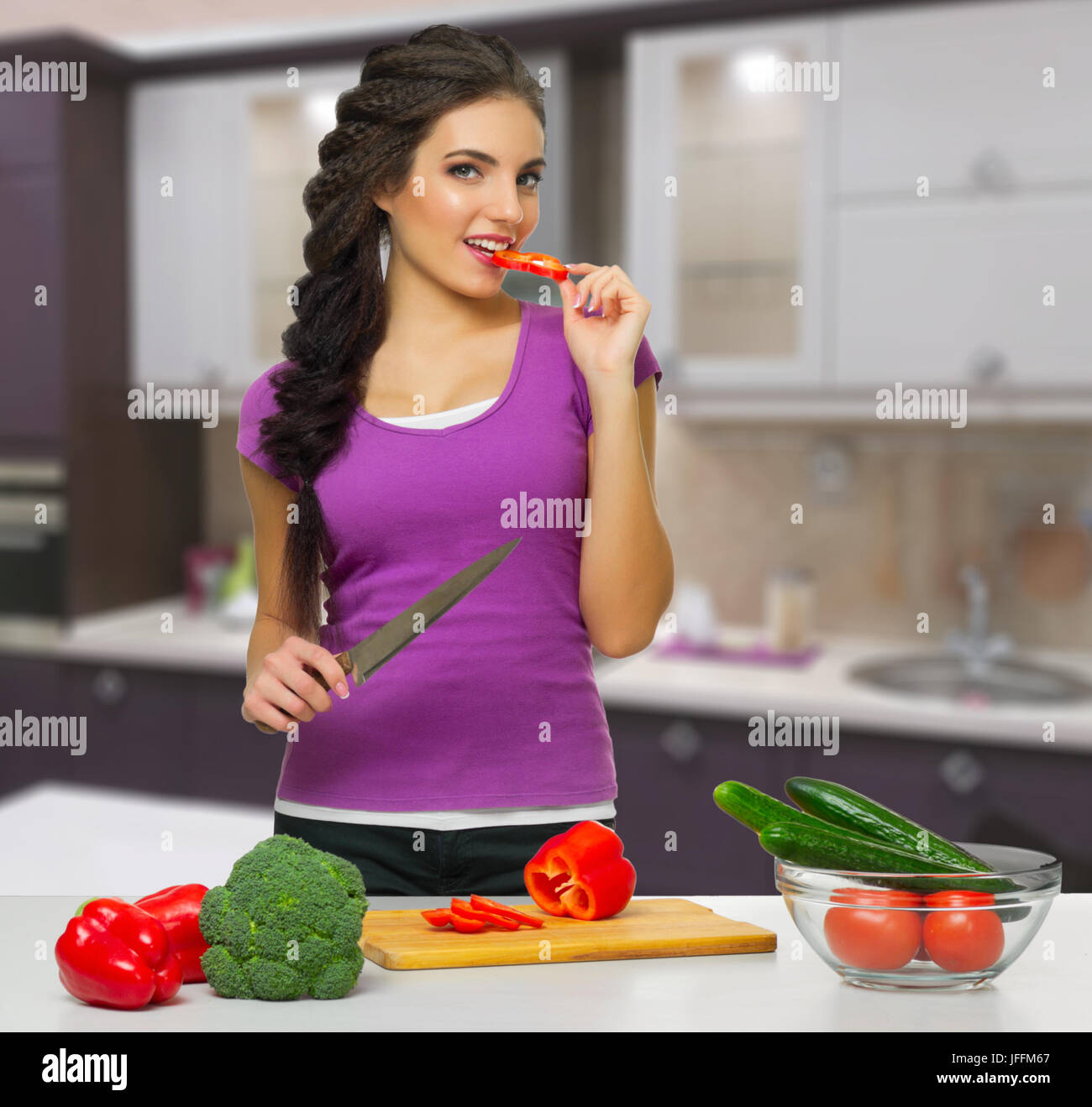 Young cooking woman at kitchen Stock Photo