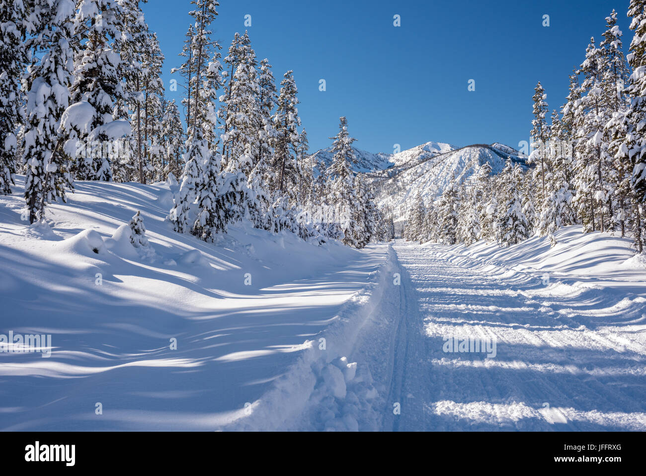 Winter in Idaho with snow covered road and mountains Stock Photo Alamy