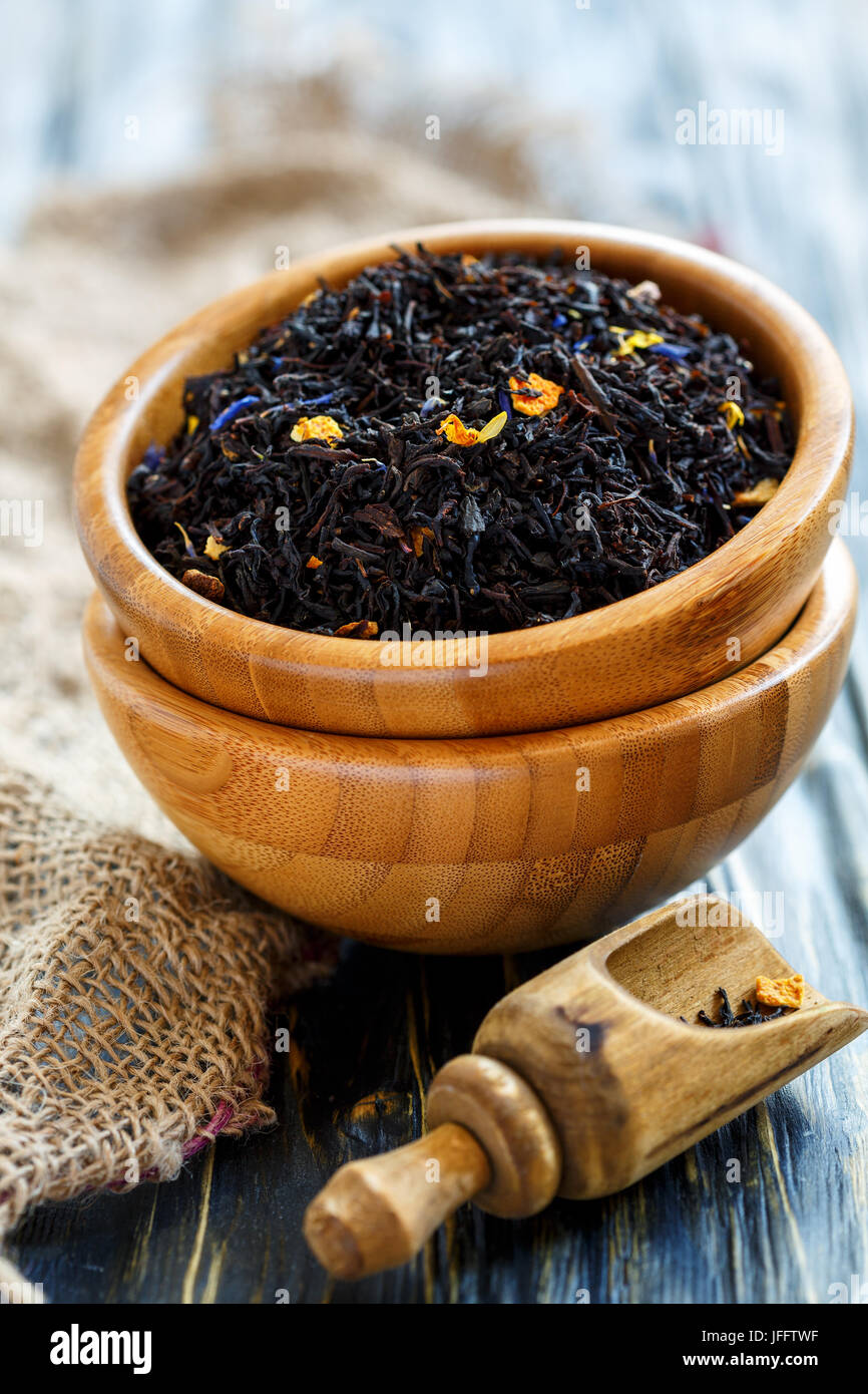 Bowls of black tea with bergamot and scoop Stock Photo Alamy