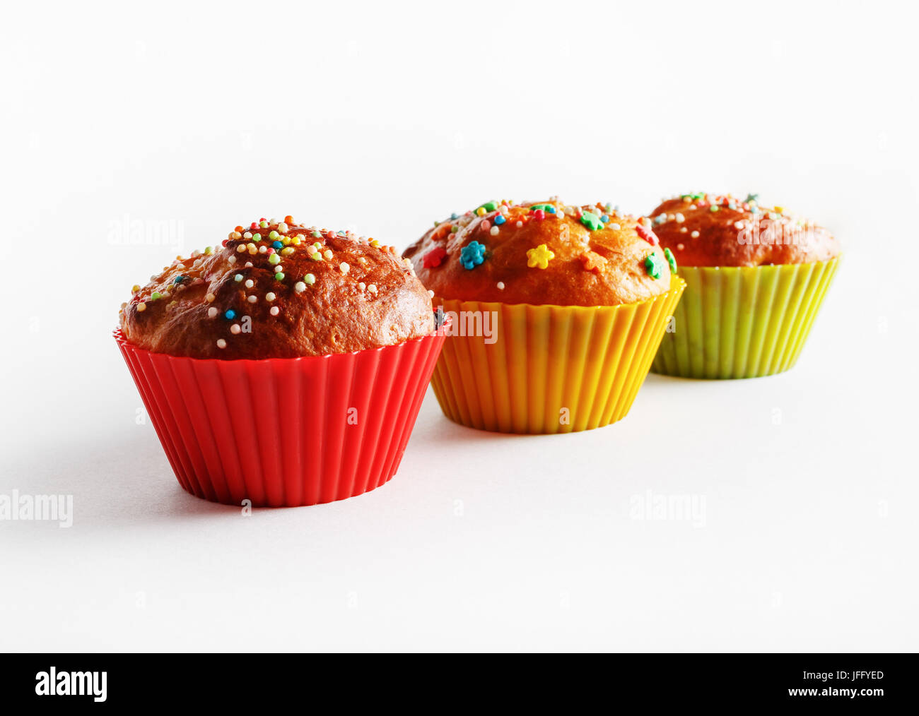 Three sweet cupcakes Stock Photo - Alamy