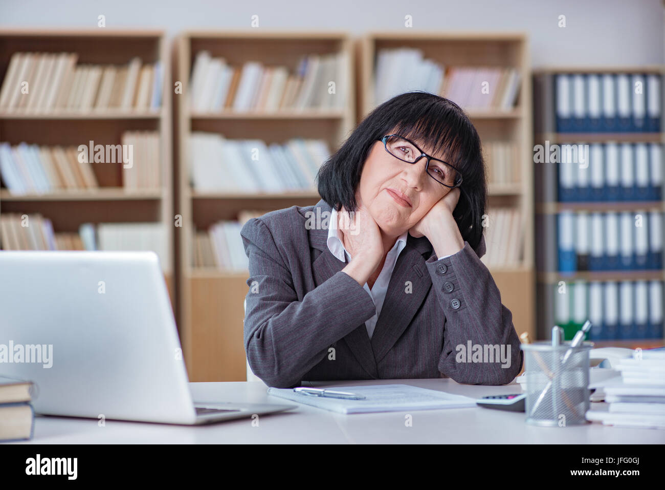 Mature businesswoman working in the office Stock Photo - Alamy