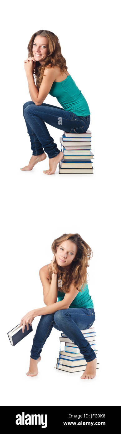 Student sitting on stack of books Stock Photo - Alamy