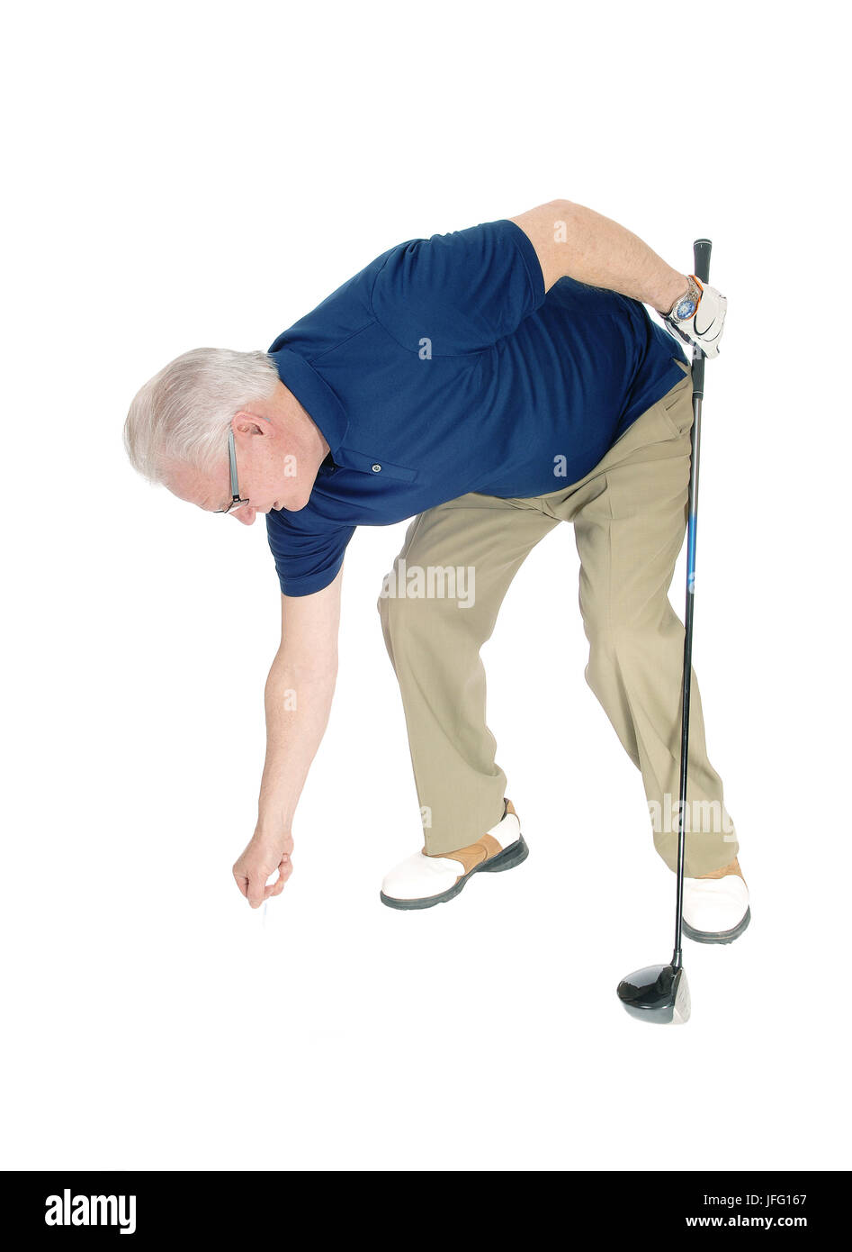 Senior man pleasing his golf ball. Stock Photo