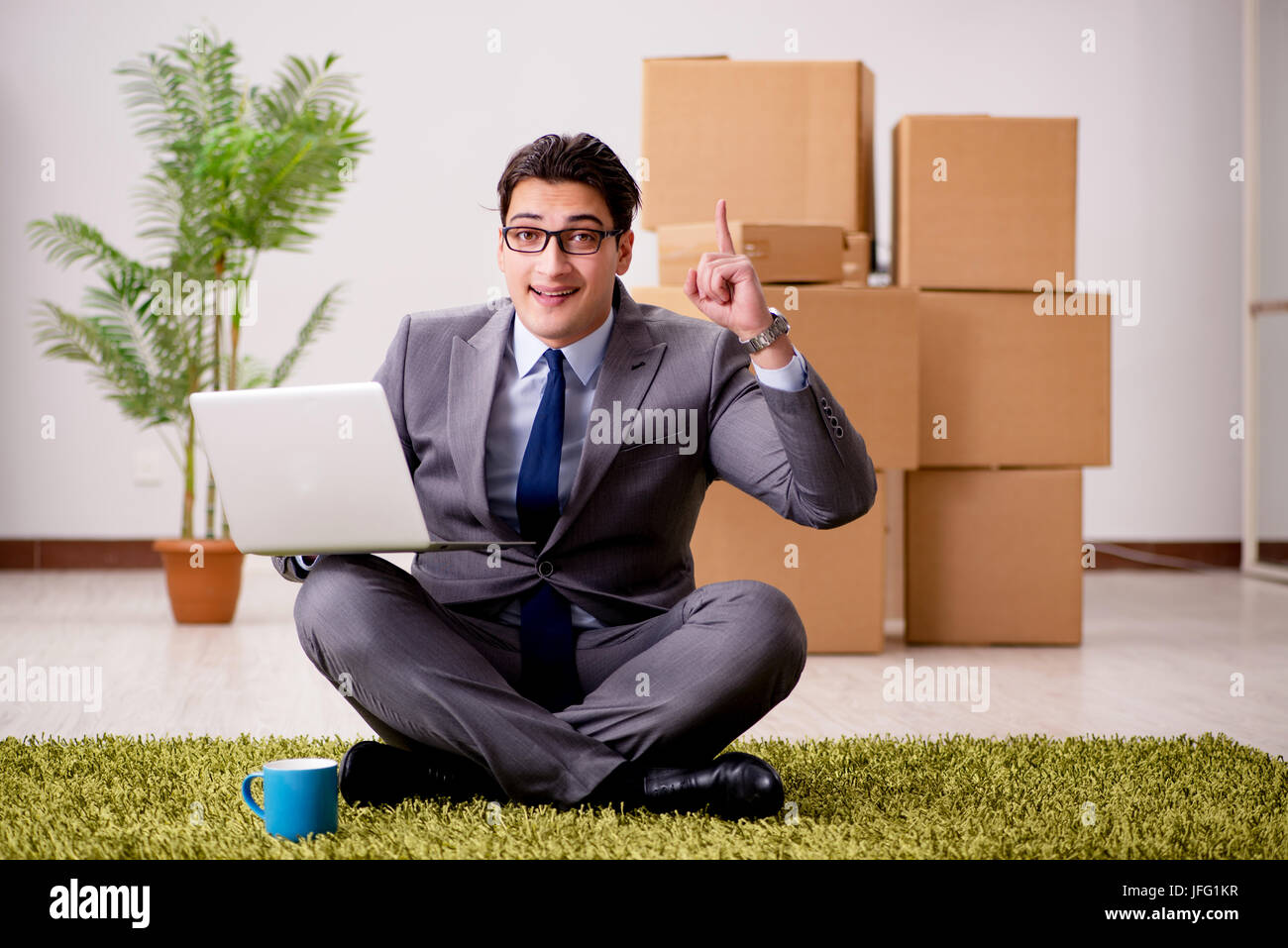 Businessman sitting cross legged on floor hi-res stock photography and ...