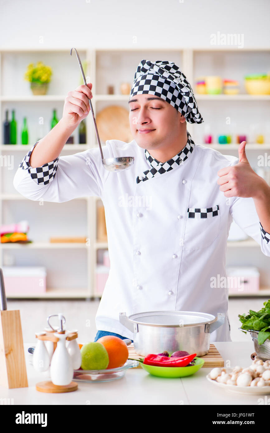 Work About Cook Young male cook working in the kitchen Stock Photo - Alamy