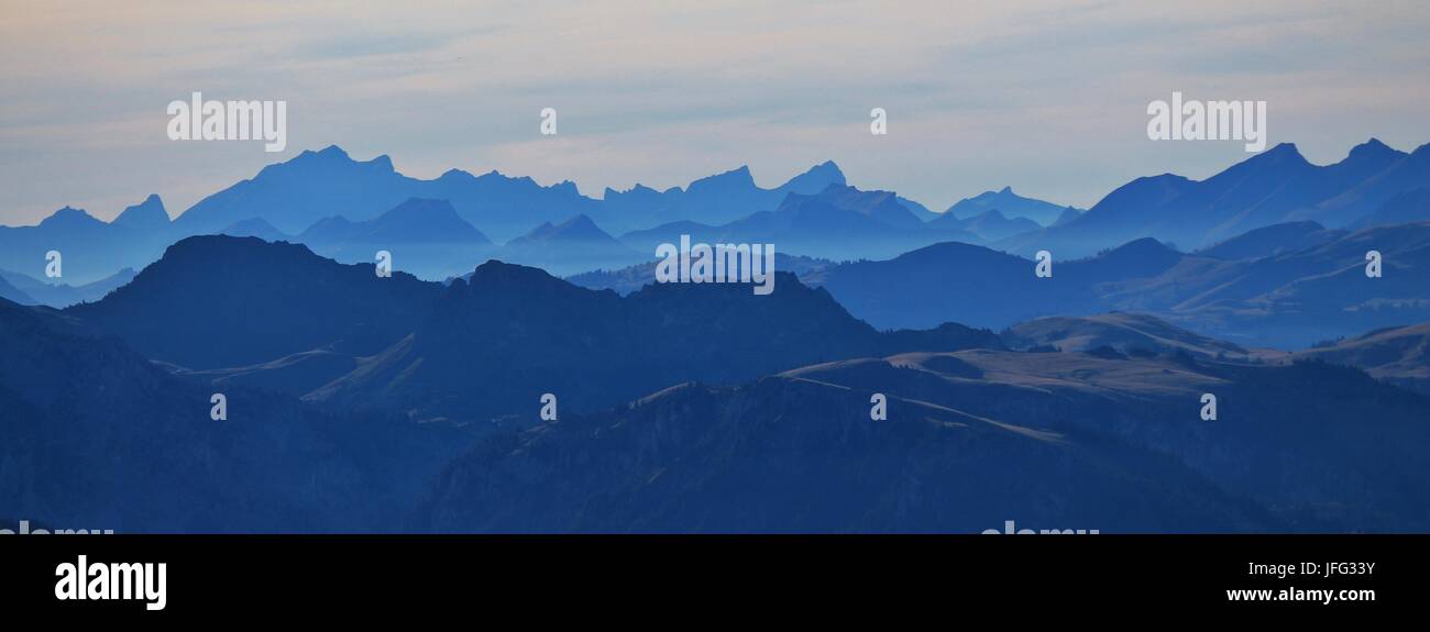 Silhouettes of mountains in the Swiss Alps Stock Photo