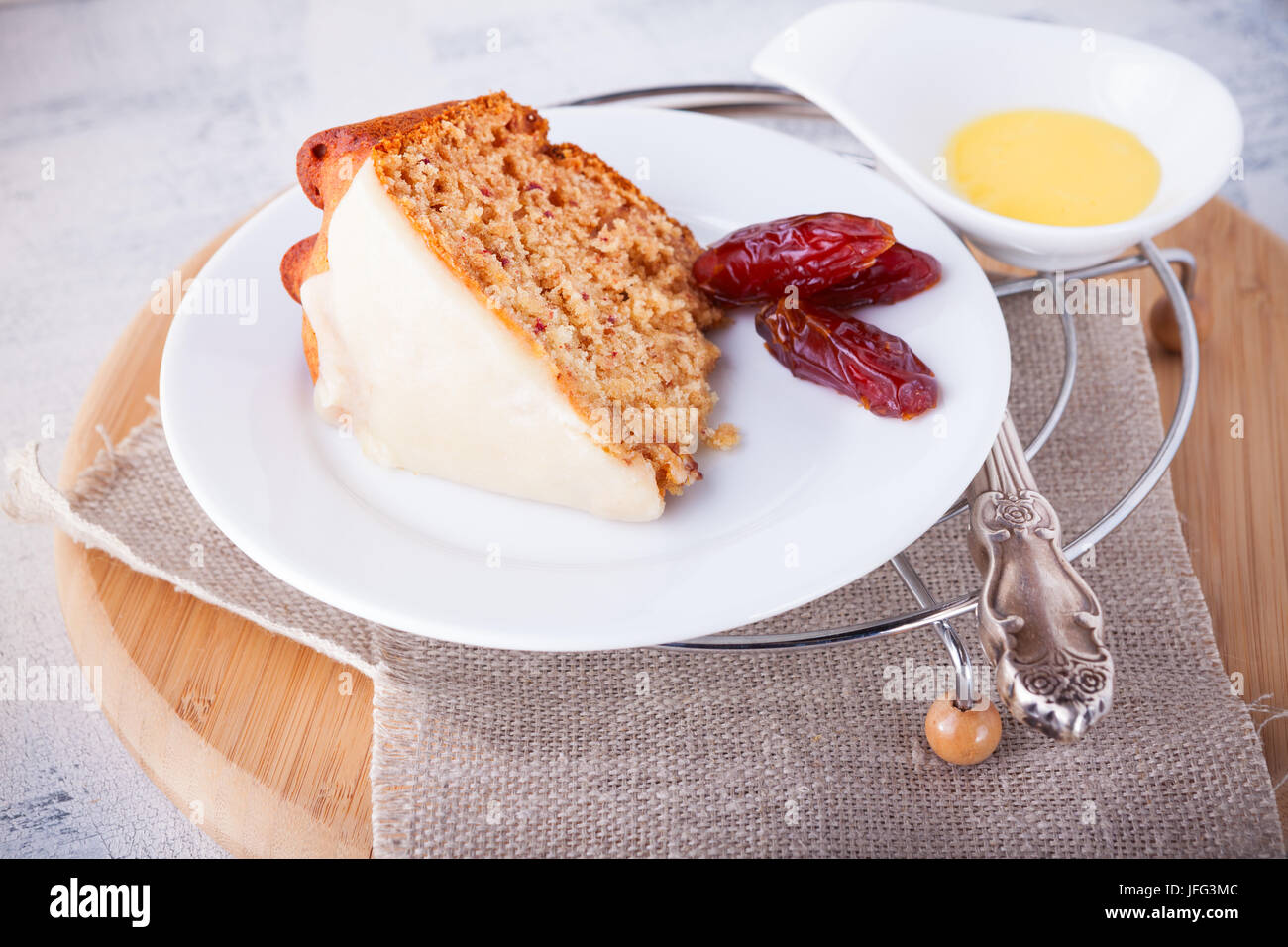 Slice of date cake and dates Stock Photo Alamy