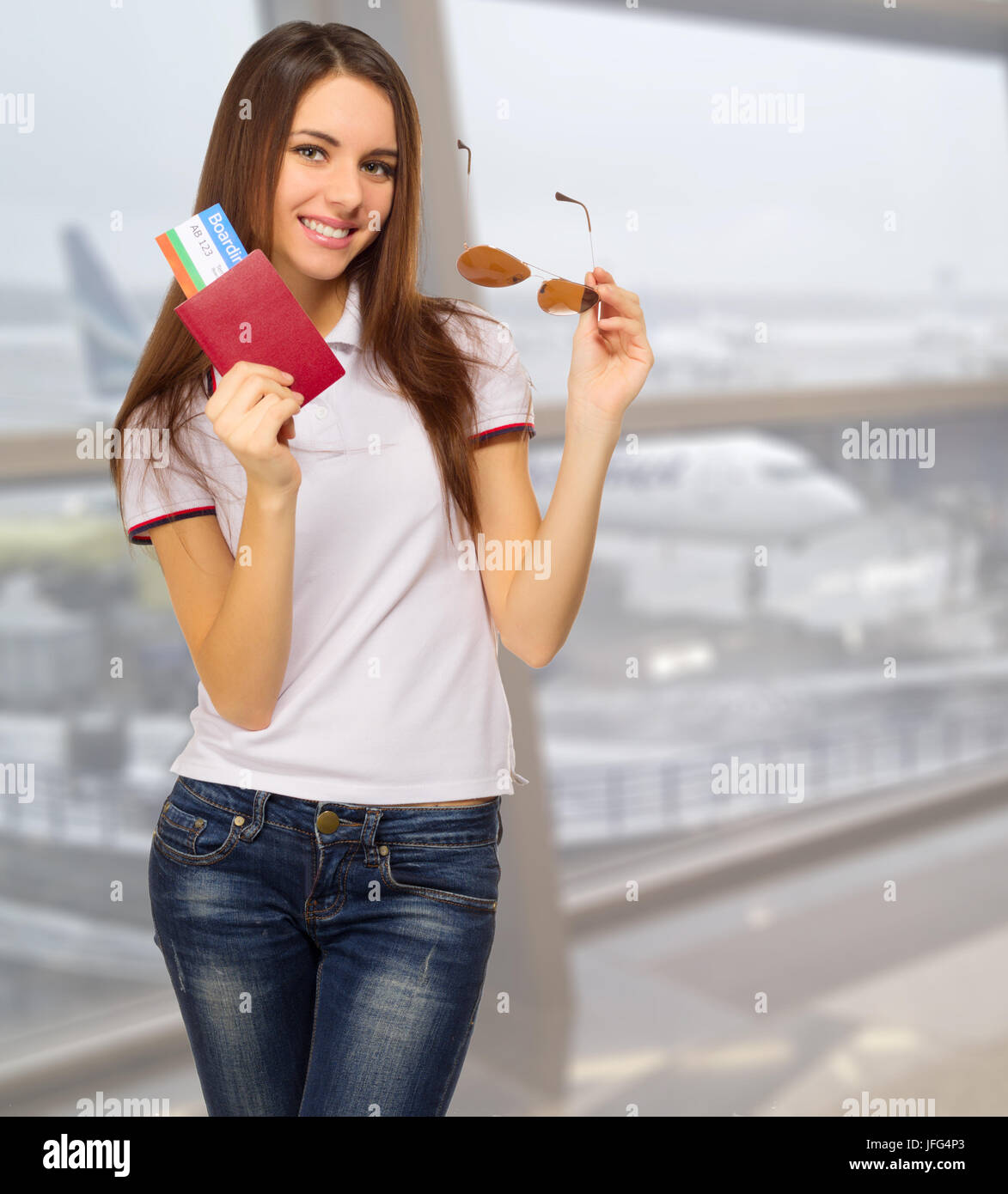Young travelling girl at airport Stock Photo