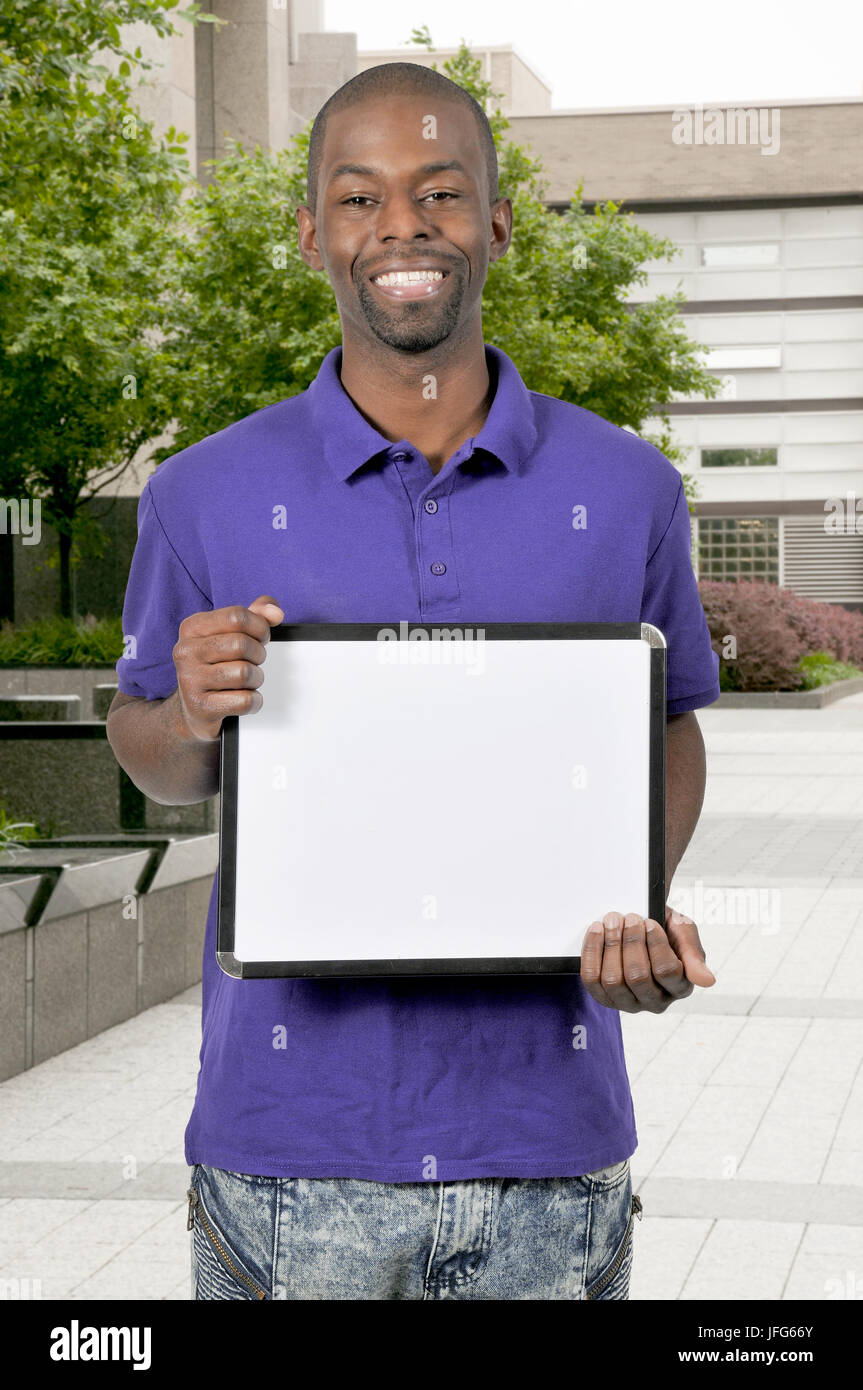 Man Holding Blank Sign Stock Photos, Pictures & Royalty Free Images