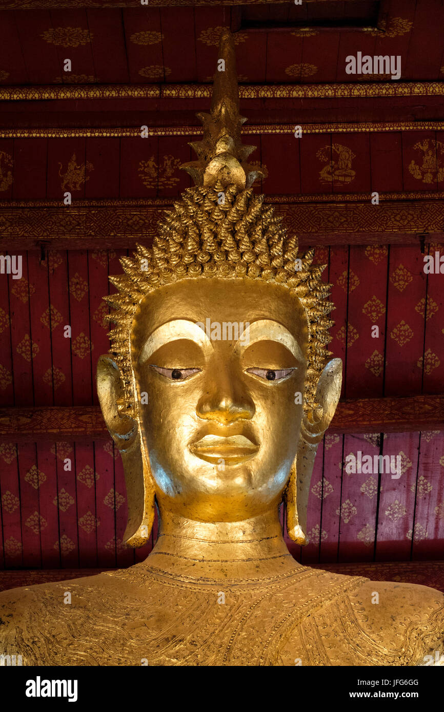 Golden Buddah statue head at Wat Mai Suwannaphumaham (aka Vat May) temple, Luang Prabang, Laos, Asia Stock Photo