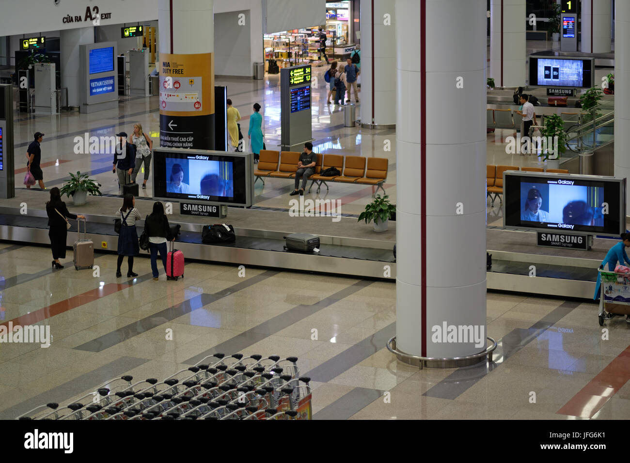 Passengers waiting for their luggage at Noi Bai Hanoi International Airport, Vietnam, Asia Stock Photo