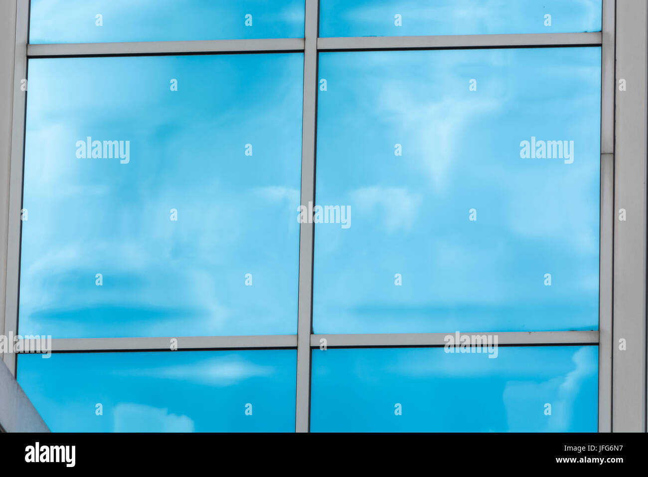 Glass building facade with reflections Stock Photo