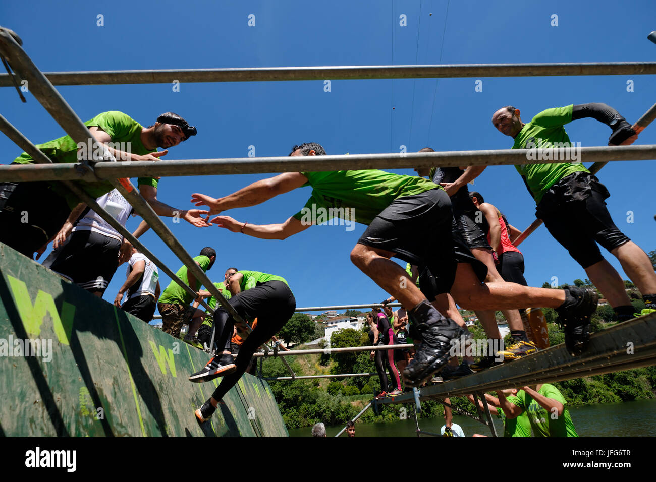 Athletes participating on an obstacle course race Stock Photo