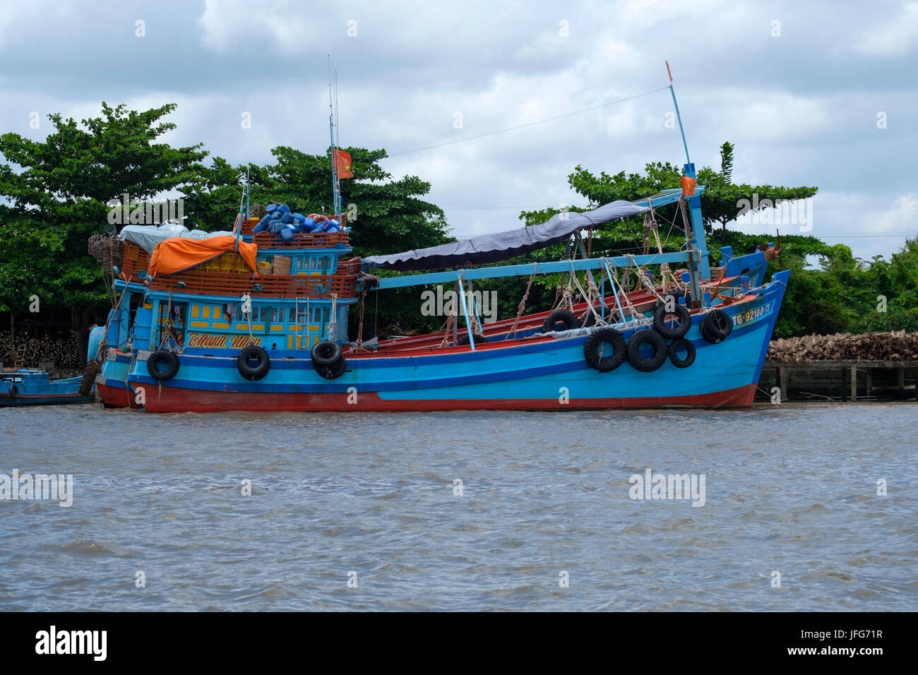 Colorful fishing boat on the Mekong river Stock Photo