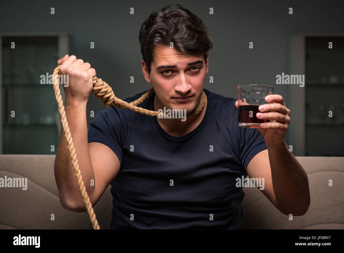 Desperate man thinking of suicide Stock Photo