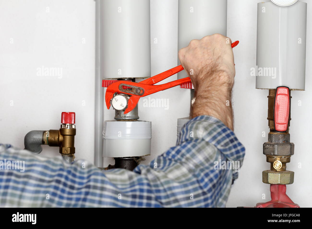 worker is repairing a valve Stock Photo