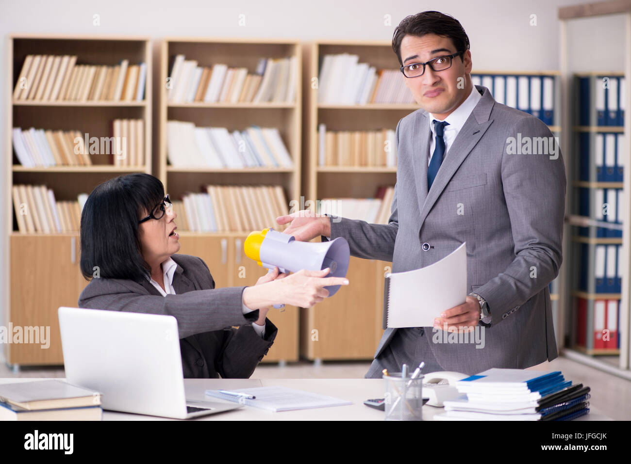 Angry boss reprimanding subordinate employee Stock Photo