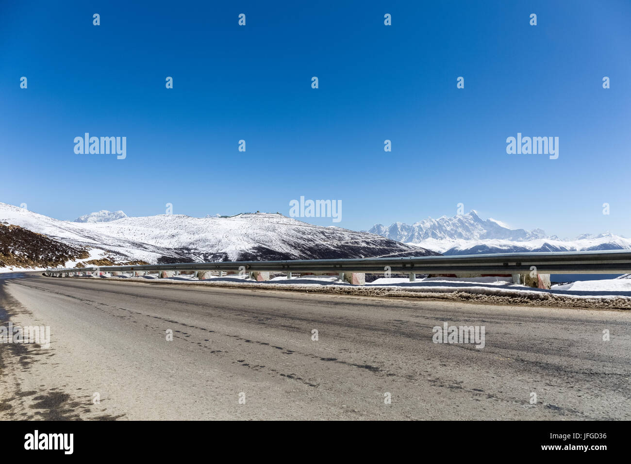 highway with snow mountain Stock Photo