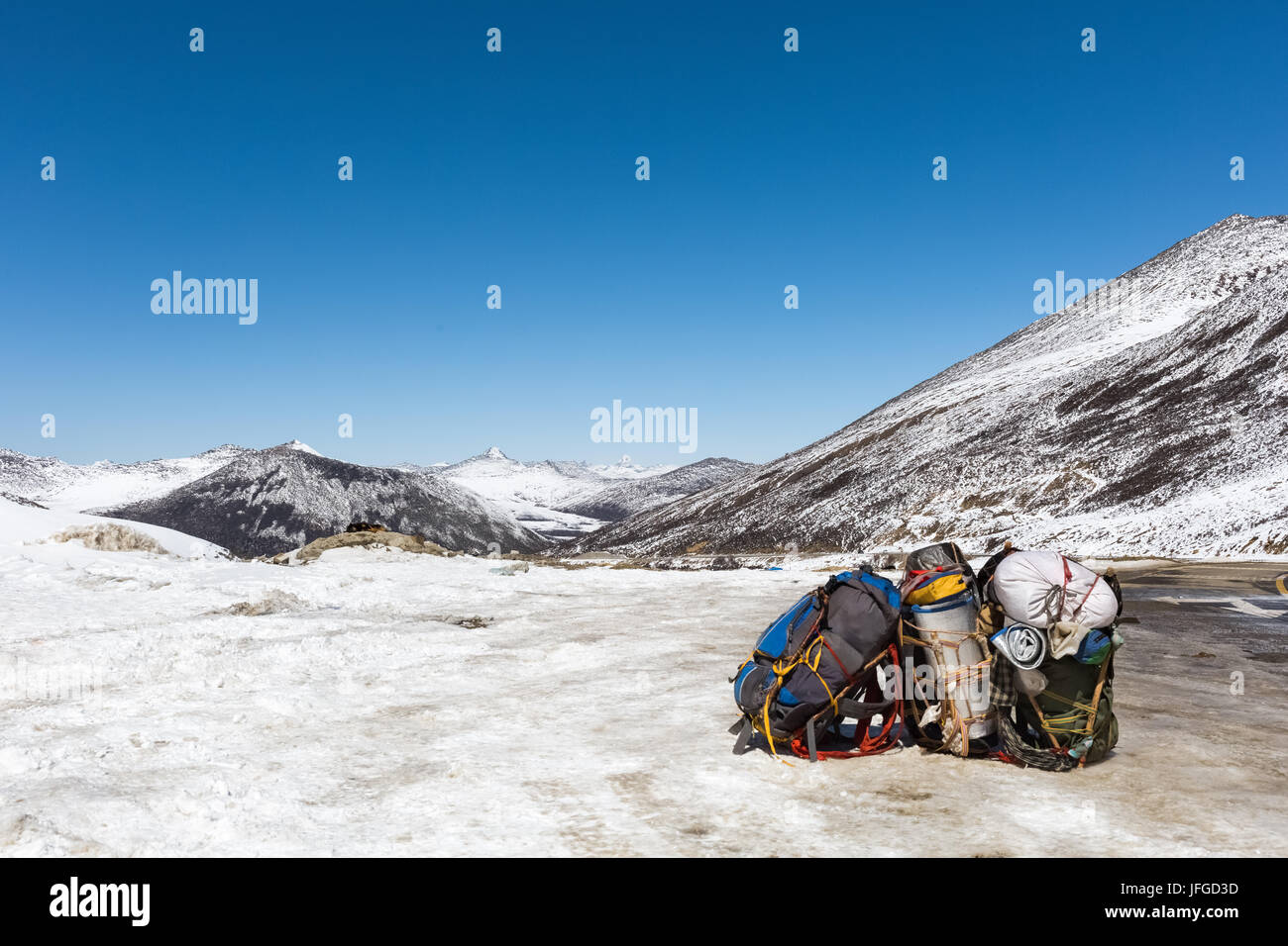 pilgrims backpack with snow mountain Stock Photo
