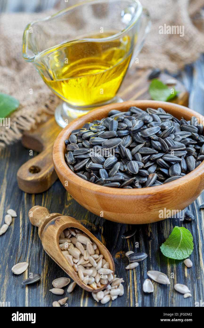 Sunflower seeds and oil in the cup. Stock Photo