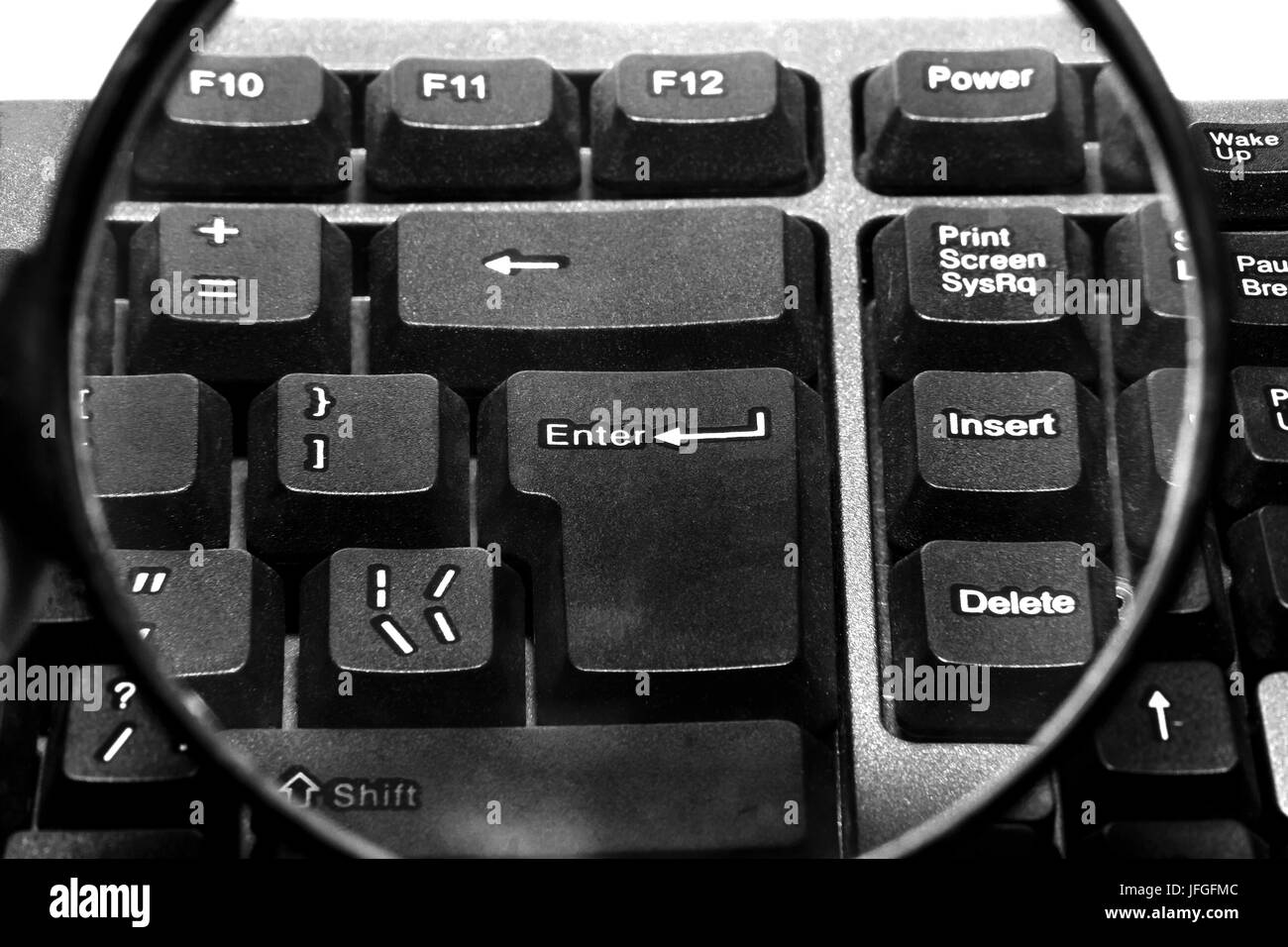Computer keyboard with magnifying glass Stock Photo Alamy