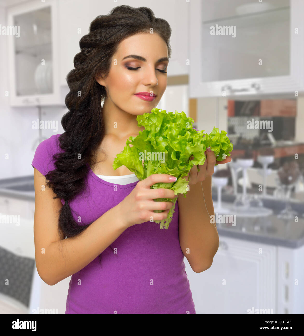 Young cooking woman in the kitchen Stock Photo