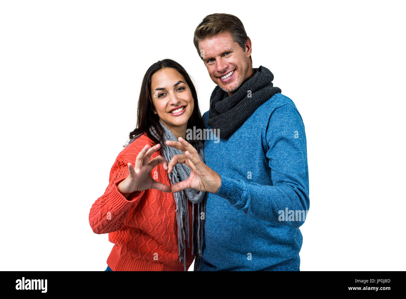 Portrait of couple making heart shape with hands Stock Photo - Alamy
