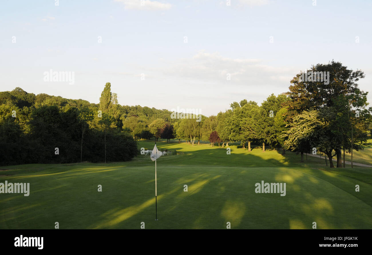 View over the Green and flag to Fairway of 18th Hole, East Course, Sundridge Park Golf Club, Bromley, Kent, England Stock Photo