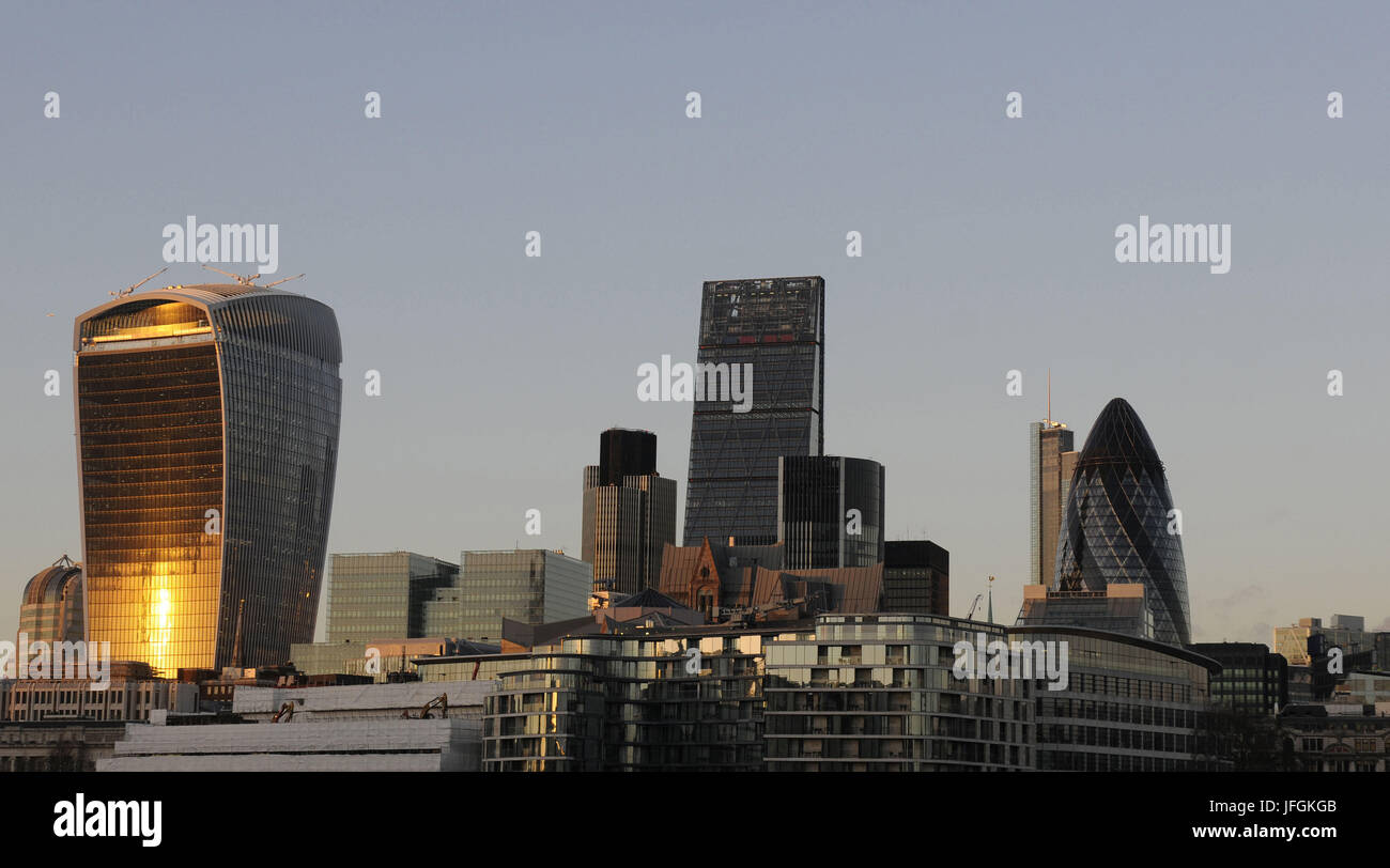 The Modern skyline of the City of London with The Walkie Talkie Building, The Gherkin, The Cheesegrater at sundown, London, England Stock Photo