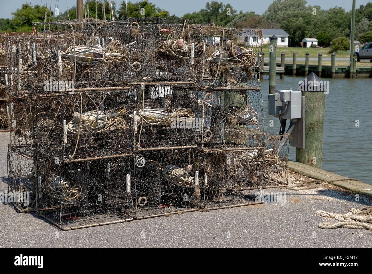 Commercial crab pots stacked on a dock Stock Photo Alamy