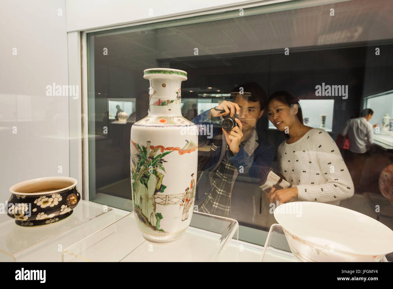 China, Shanghai, Shanghai Museum, Couple Looking at Ancient Pottery Display Stock Photo