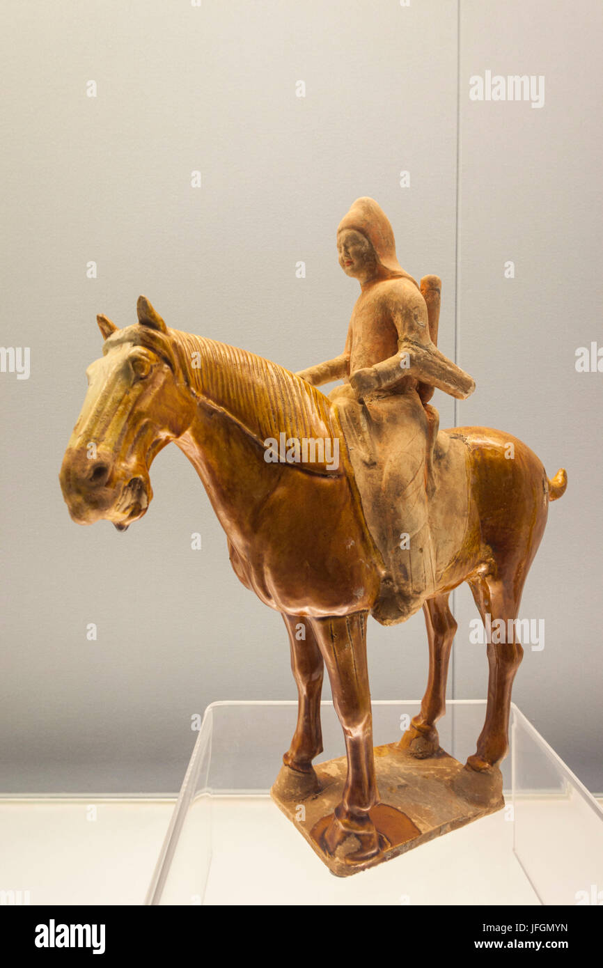 China, Shanghai, Shanghai Museum, Tang Dynasty (618-907 AD) Glazed Pottery Figure of a Man Riding a Horse Stock Photo
