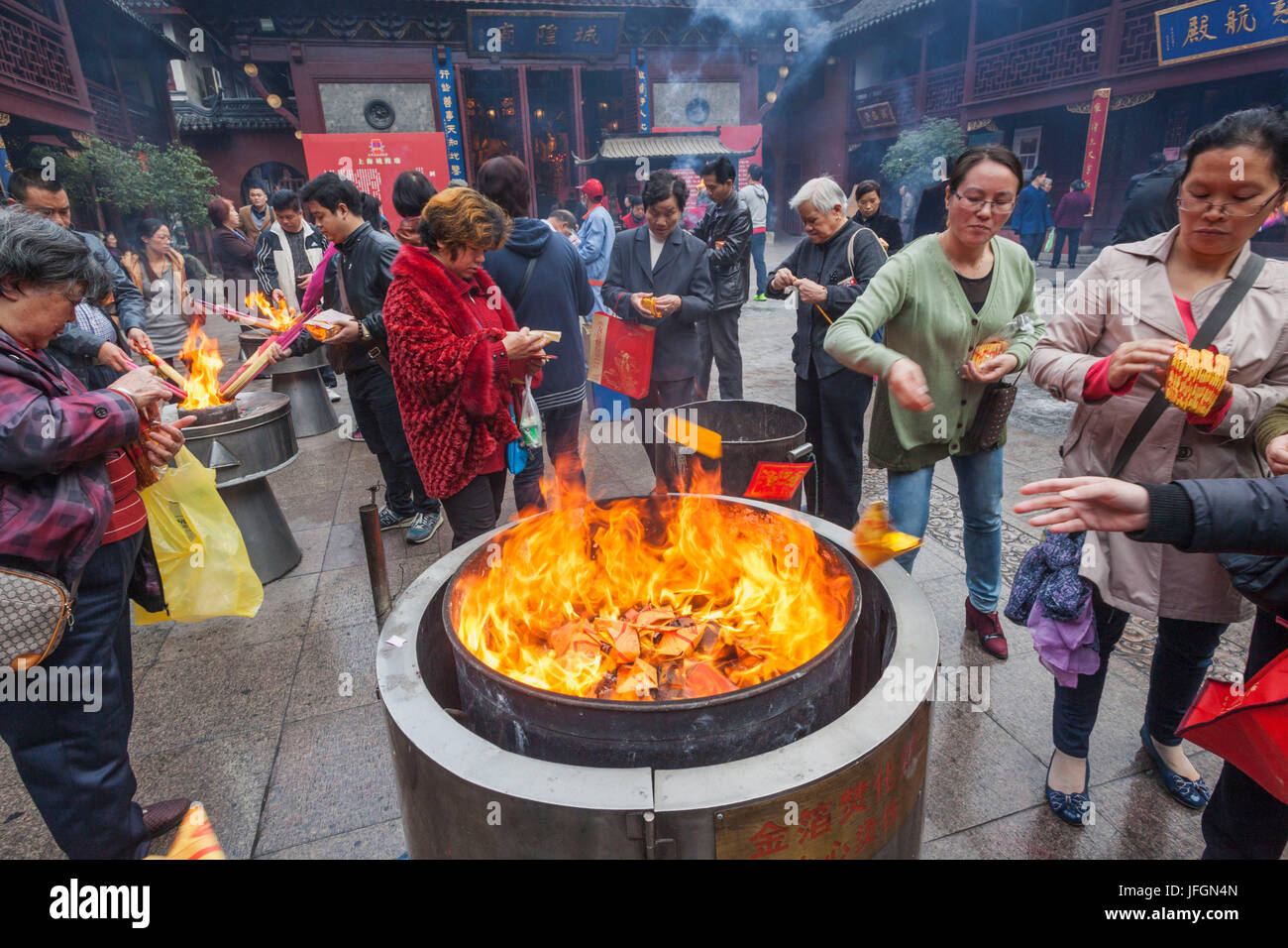 China, Shanghai, Yuyuan Garden, City God Temple of Shanghai, Worshippers Burning Fortune Paper Stock Photo